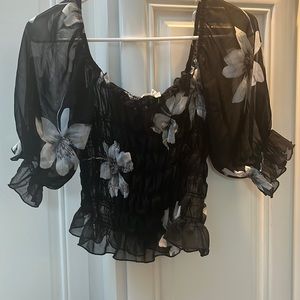 Black sheer ruffle top with white flowers